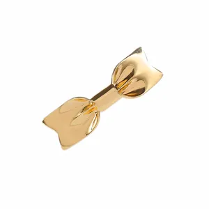 Eleganter goldener Metall-Haarclip in Schleifenform mit polierter Oberfläche für Damen