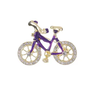 Exquisite purple enamel bicycle brooch with sparkling rhinestones in gold alloy frame