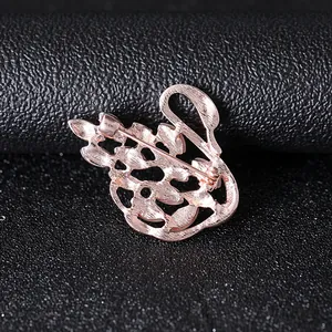 Detailed back view of a rose gold swan brooch showing the clasp and hollowed alloy craft