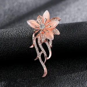 Macro detail of tulip flower brooch with rose gold finish and pink crystal stones