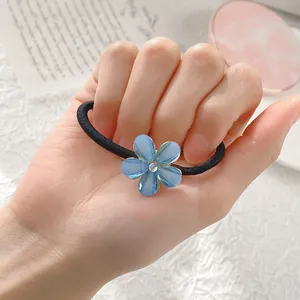 Élastique à cheveux avec fleur bleue, strass brillant et ruban extensible