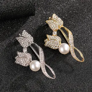 Macro detail of tulip brooch with sparkling rhinestones and white pearls on black texture