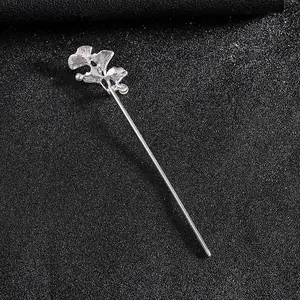 Close-up of silver ginkgo leaf hairpin with detailed metal texture for Hanfu styling