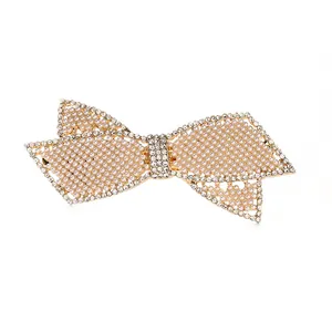 Elegante fermaglio per capelli a fiocco con perle bianche e strass su base in lega dorata