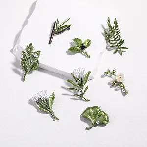 Set of 7 vintage green enamel leaf and flower brooches with white pearls for women