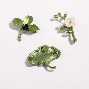 Three-piece forest style green plant and pearl brooch set with floral leaf designs