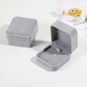 Premium light grey velvet jewelry box for rings and earrings in a flat lay minimalist setting