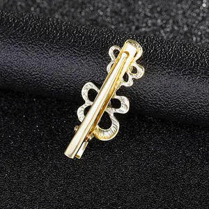 Elegant gold metal flower hair clip with rhinestones and hollow-out texture for women