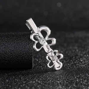Detailed view of silver flower hair clip with sparkling rhinestones and duckbill clasp
