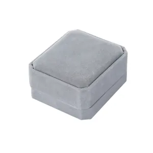 Macro detail of octagonal grey velvet jewelry box showing luxury fabric texture