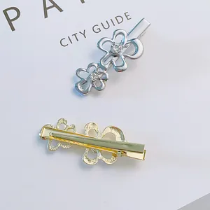 Gold and silver floral alloy hair clips with sparkling rhinestones in a minimalist design