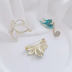 Three-piece set of vintage butterfly and insect brooches with rhinestones and enamel