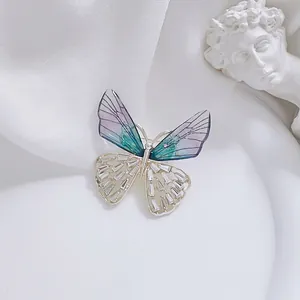 Elegant butterfly brooch with purple gradient wings and silver inlaid zircon stones