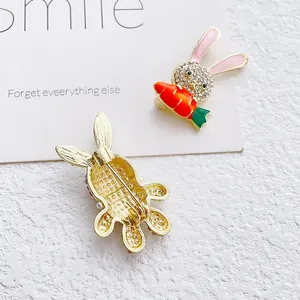 Cute bunny brooch with rhinestones and carrot charm shown with front and back view
