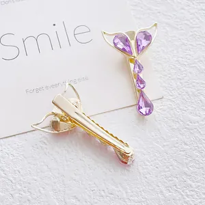 Elegant gold fishtail hair clip with purple crystal heart and drop stones for women