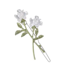 Elegant white rose hair clip with green leaves and metal clasp for women's hairstyling