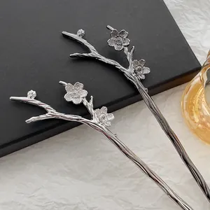 Silver plum blossom hair sticks in a traditional Chinese alloy metal design for women