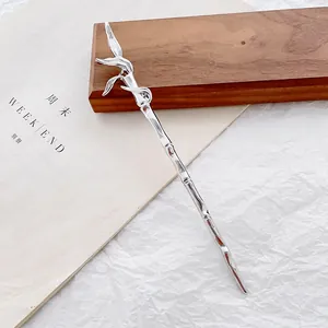 Elegant bamboo-shaped silver alloy hair stick with leaf details on aesthetic background