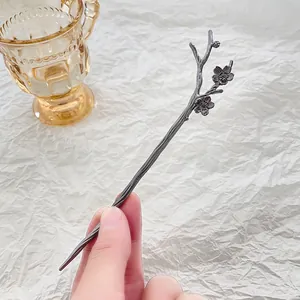 Elegant plum blossom alloy hair stick with dark grey branch design for traditional styling