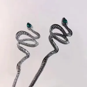 Elegant silver alloy snake hair pins with green gemstone eyes and scaly texture