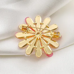 Elegant sunflower brooch back view showing golden pin clasp and pink enamel petals