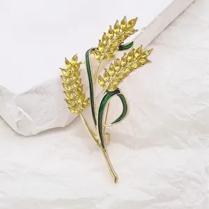 Exquisite golden wheat brooch with yellow gemstones and green enamel for women