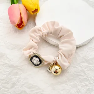 Elegant French style camellia hair scrunchie with pink satin fabric and pearl accents