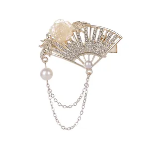 Golden fan hair clip with rhinestones, 3D flower and pearl tassels in vintage style