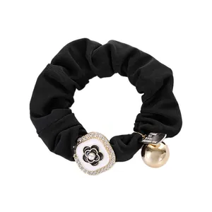 French style black fabric scrunchie with camellia flower, rhinestones and golden charm