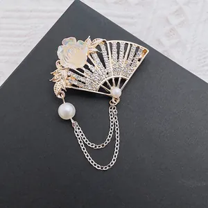 Vintage gold fan brooch with white flower, rhinestones, pearls and layered chains