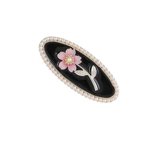 Elegant rose duckbill clip with black base, gold border and white pearls