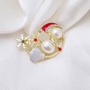 Exquisite Christmas brooch with pearls, rhinestones, and red enamel hat on white silk