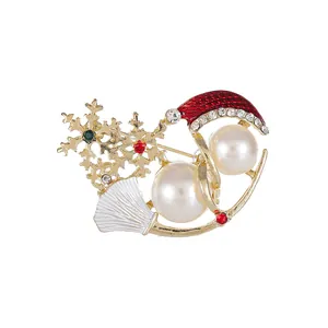 Christmas snowman brooch with pearls, red enamel hat and snowflakes on gold plating