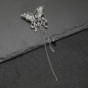 Silver liquid metal butterfly brooch with black gemstone and long tassel chains