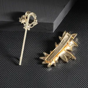 Elegant gold maple leaf hair pin set with hollow metal texture and pearl details