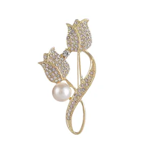 Elegant gold tulip brooch with sparkling rhinestones and a large white pearl accent