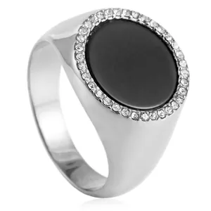 Macro detail of silver titanium steel signet ring with black stone and white zircon halo