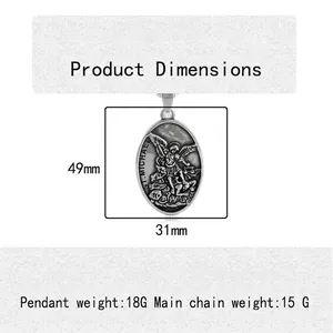 Vintage St. Michael oval pendant in silver titanium steel measuring 49mm x 31mm