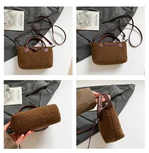 Detail of brown plush faux fur bag with leather straps and silver magnetic closure