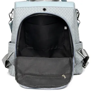 Light blue woven leather backpack with spacious main compartment and interior pocket
