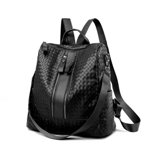 Black woven leather backpack for women with dual zippers and multi-way shoulder straps