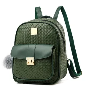 Detailed macro view of dark green woven leather texture and golden metal buckle closure