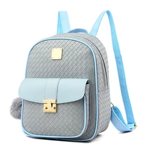 Detailed view of woven texture and golden metal buckle on blue and gray backpack