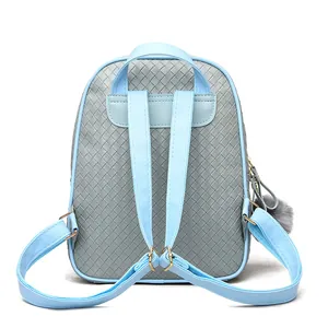 Detail of grey woven leather backpack with light blue straps and grey pompom charm