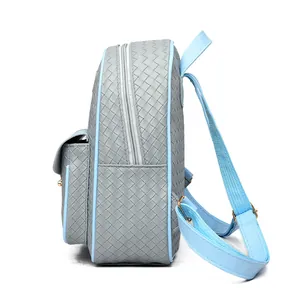 Side view of grey embossed PU leather backpack with light blue straps and metal clasp