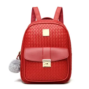 Detailed view of red PU leather backpack with diamond woven texture and gold metal buckle