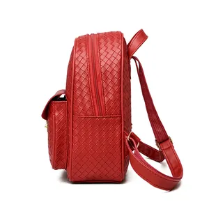 Detail view of red woven PU leather backpack showing side profile and double zipper