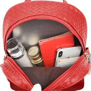 Interior view showing the large capacity of a red woven PU leather backpack for daily use
