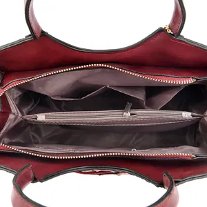 Interior view of crocodile pattern tote bag with multi-layer storage and metal zippers