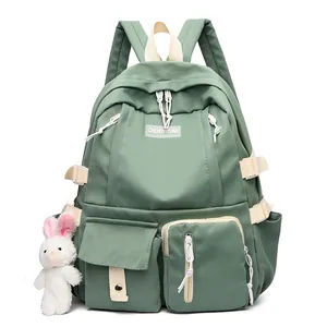 Contrast color nylon backpack for students featuring large capacity and a cute plush rabbit